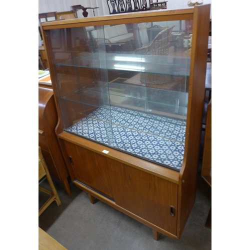 62 - A teak display cabinet