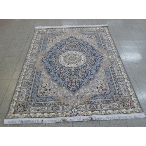 158 - An Iranian beige ground rug, 242cm x 162cm