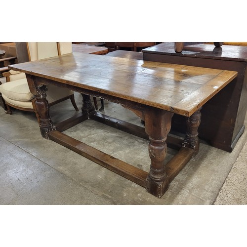 167 - A 17th Century style oak refectory table