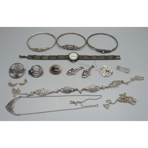 1008 - A collection of silver jewellery including Arts and Crafts style and Celtic style and a silver wrist... 