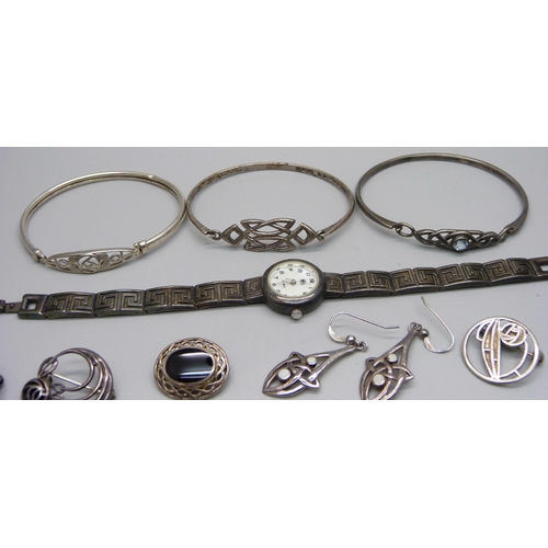 1008 - A collection of silver jewellery including Arts and Crafts style and Celtic style and a silver wrist... 