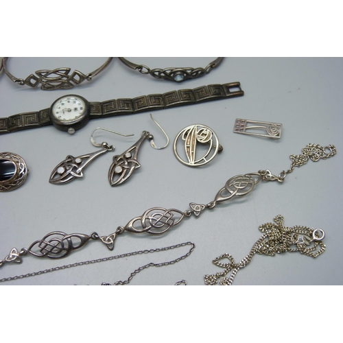 1008 - A collection of silver jewellery including Arts and Crafts style and Celtic style and a silver wrist... 