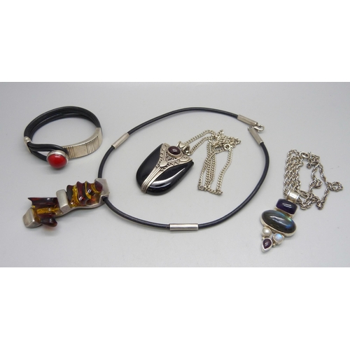 1011 - A silver mounted necklet, two stone set pendants on silver chains and a bracelet