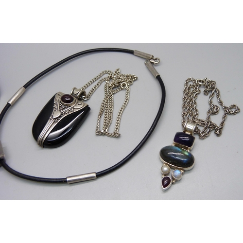 1011 - A silver mounted necklet, two stone set pendants on silver chains and a bracelet