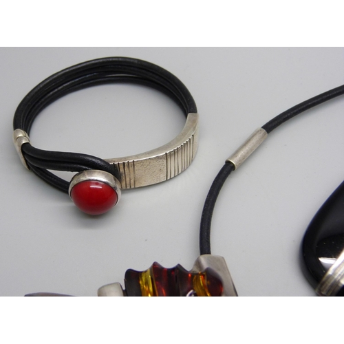 1011 - A silver mounted necklet, two stone set pendants on silver chains and a bracelet