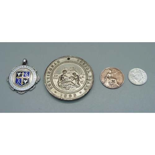 1017 - A 1914 silver 3d coin, a 1917 farthing, a silver and enamel fob medal marked Mansfield Schools Sport... 