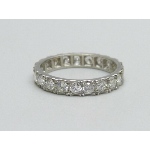 1019 - A platinum and diamond eternity ring, (marked plat on side of ring), 3g, L