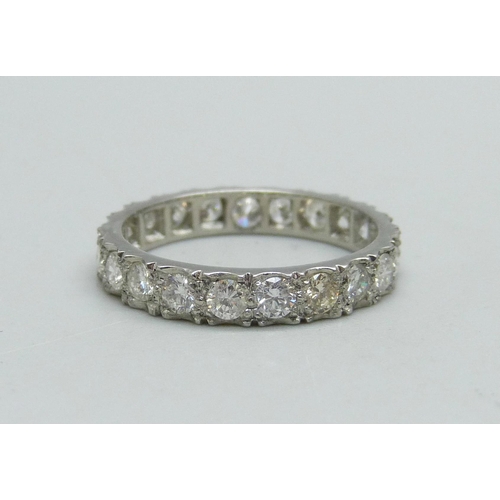 1019 - A platinum and diamond eternity ring, (marked plat on side of ring), 3g, L