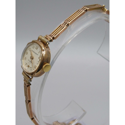 1022 - A lady's 9ct gold cased President wristwatch on a 9ct gold bracelet, weight without movement 10.4g