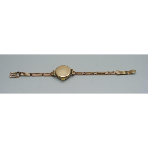 1022 - A lady's 9ct gold cased President wristwatch on a 9ct gold bracelet, weight without movement 10.4g