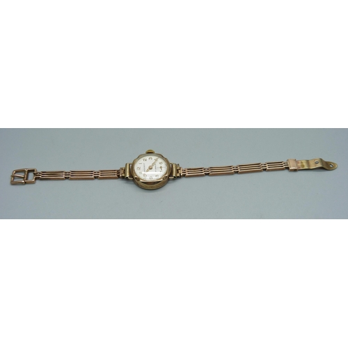 1022 - A lady's 9ct gold cased President wristwatch on a 9ct gold bracelet, weight without movement 10.4g