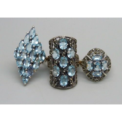 1023 - Three silver and pale blue stone set rings, Q and 2x R