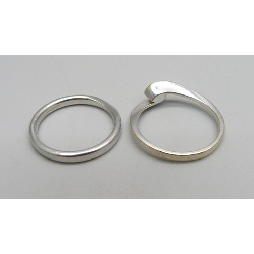 1032 - A hallmarked platinum wedding ring, 4.3g, M/N, and a 9ct white gold and diamond ring, 2g, M/N