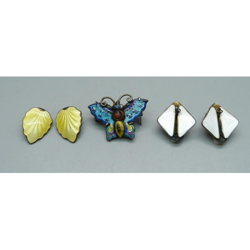 1033 - A white metal and enamel butterfly brooch and two pairs of silver and enamel earrings, both marked N... 