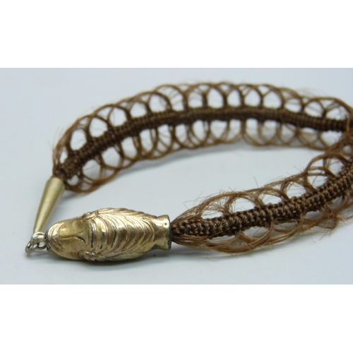 1034 - A Victorian 'hair' bracelet with gilt metal clasp