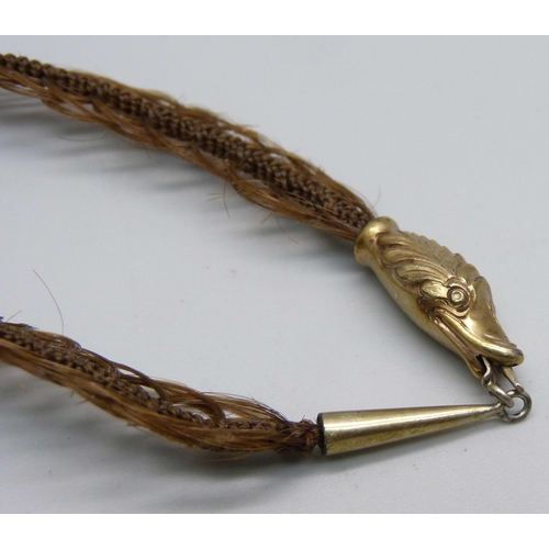 1034 - A Victorian 'hair' bracelet with gilt metal clasp