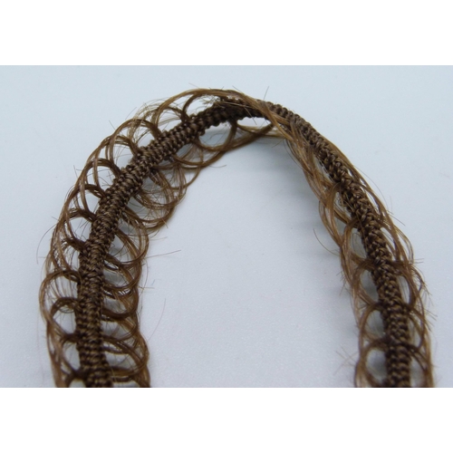 1034 - A Victorian 'hair' bracelet with gilt metal clasp