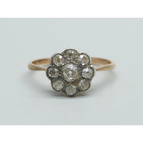 1039 - A Victorian diamond cluster ring with gold shank and silver setting, 1.7g, N/O