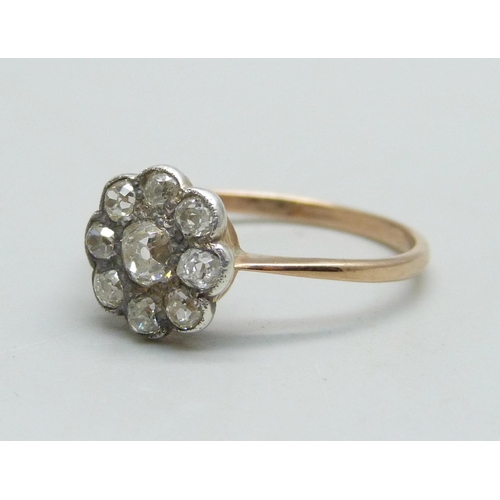 1039 - A Victorian diamond cluster ring with gold shank and silver setting, 1.7g, N/O