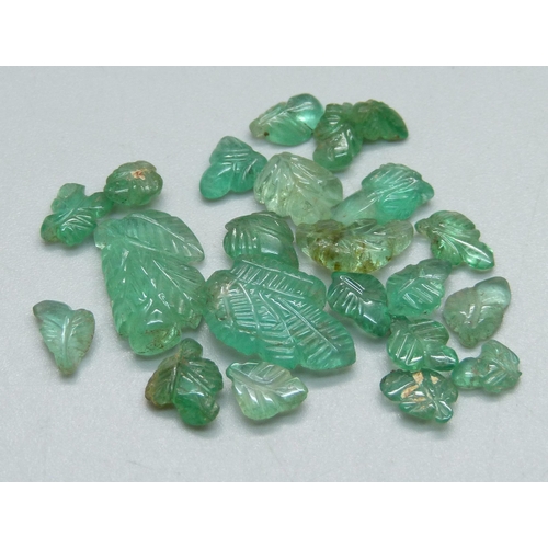 1042 - A collection of unmounted carved emeralds, total weight 29.8g