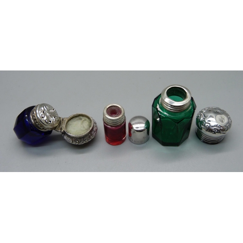 1052 - A pocket barometer, a/f, two silver topped scent bottles, a blue glass and white metal topped vinaig... 