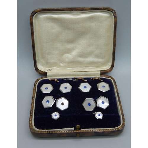 1053 - A cased set of silver, mother of pearl and blue stone studs and cufflinks