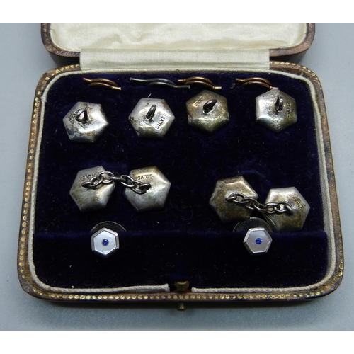 1053 - A cased set of silver, mother of pearl and blue stone studs and cufflinks