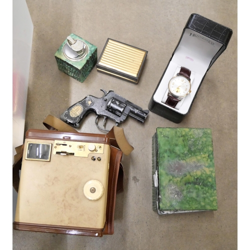 1094 - A box of assorted items; a Lone Star toy gun, a Kodak Brownie camera, a smoking set, watches, etc. *... 