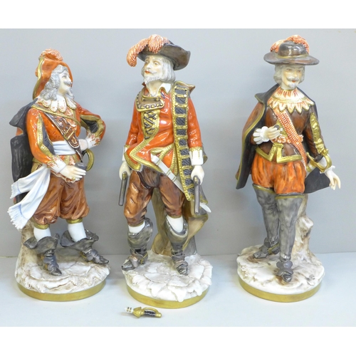 606 - A set of three German Unter Weiss Bach figures of the Three Musketeers, one sword on one figure a/f