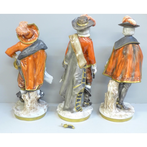 606 - A set of three German Unter Weiss Bach figures of the Three Musketeers, one sword on one figure a/f