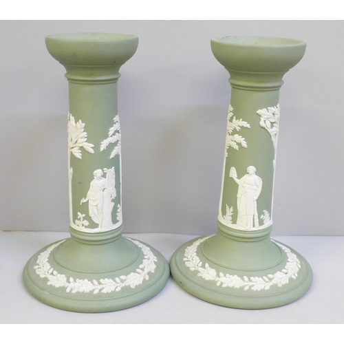 608 - A pair of Wedgwood green Jasper candlesticks, 17cm