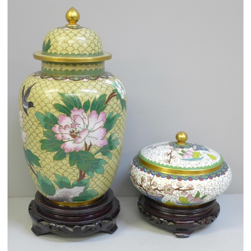 609 - A cloisonne vase and cover and a cloisonne lidded pot and cover, both with wooden bases