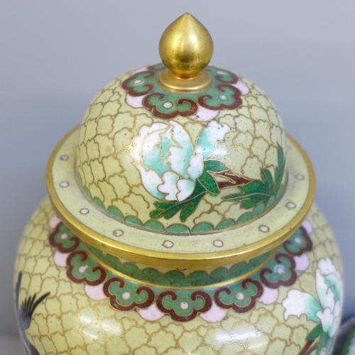 609 - A cloisonne vase and cover and a cloisonne lidded pot and cover, both with wooden bases