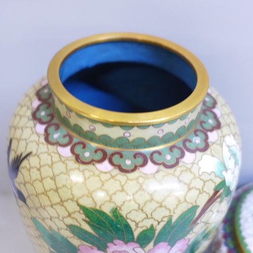 609 - A cloisonne vase and cover and a cloisonne lidded pot and cover, both with wooden bases