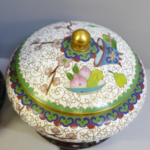 609 - A cloisonne vase and cover and a cloisonne lidded pot and cover, both with wooden bases