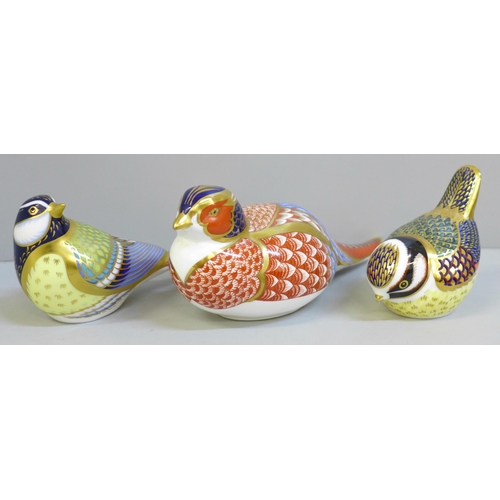 629A - Three Royal Crown Derby bird paperweights, two smaller Blue Tits with gold stoppers