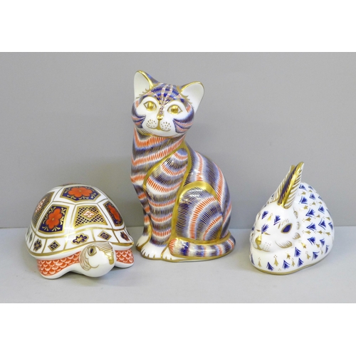 632 - Three Royal Crown Derby paperweights; rabbit and cat with gold stoppers, tortoise lacking stopper