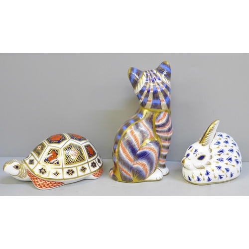 632 - Three Royal Crown Derby paperweights; rabbit and cat with gold stoppers, tortoise lacking stopper