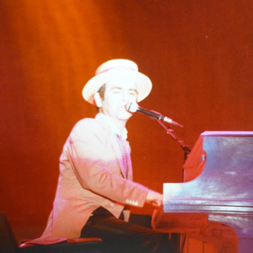 649 - Nineteen Elton John original concert photographs from the 1980s with negatives