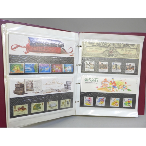 661 - An album of forty Royal Mail complete stamp sets of first day presentation packs from the early 1980... 