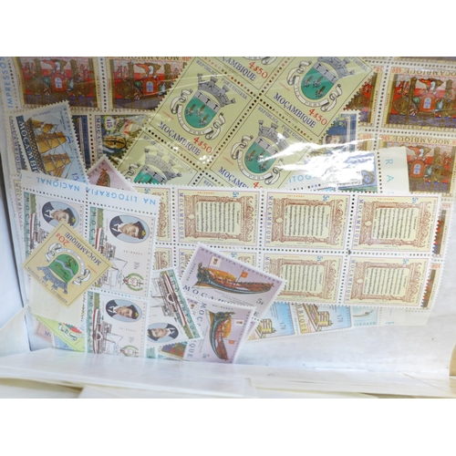 689 - Stamps; a box of world stamps on packets and stock cards