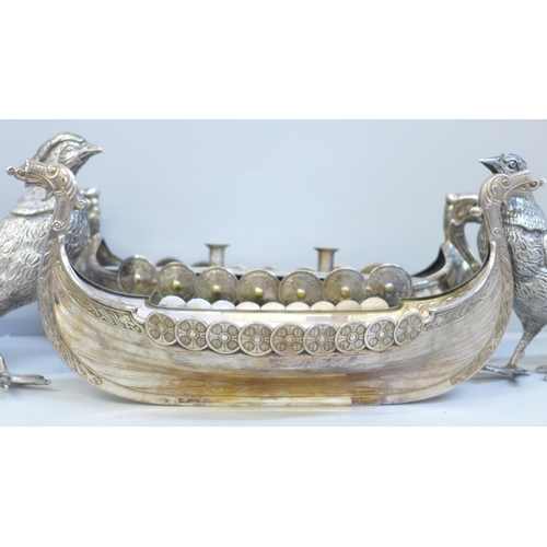 701 - Two Norwegian EPNS models of Viking long boats and a pair of plated pheasant centrepieces