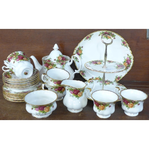 712 - A six setting Royal Albert tea set with sugar bowl, milk jug, two tier sandwich plate, teapot and pl... 