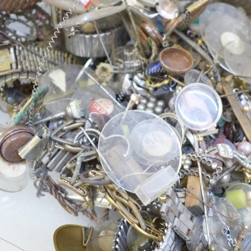 713 - A tub of wristwatch parts