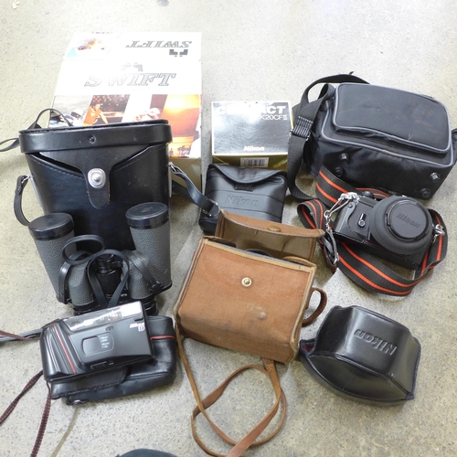 719 - A pair of Swift binoculars, 8 x 40, boxed, a Nikon EM 35mm SLR film camera, flash, one other Nikon R... 