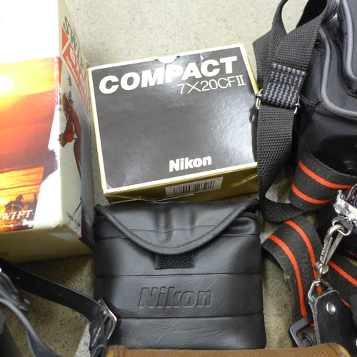 719 - A pair of Swift binoculars, 8 x 40, boxed, a Nikon EM 35mm SLR film camera, flash, one other Nikon R... 