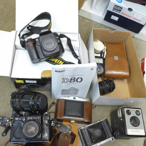 740 - A collection of cameras including a Zenit 12XP,  Agfa, Voightlander, Kodak, a wide angle lens, one o... 