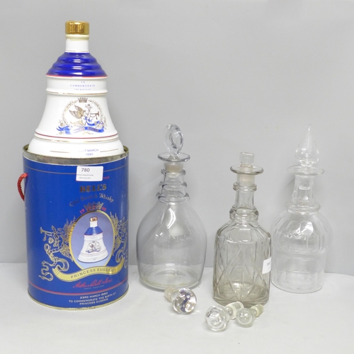 780 - Three glass decanters including a Georgian example, three decanter stoppers and a Bell's Scotch Whis... 