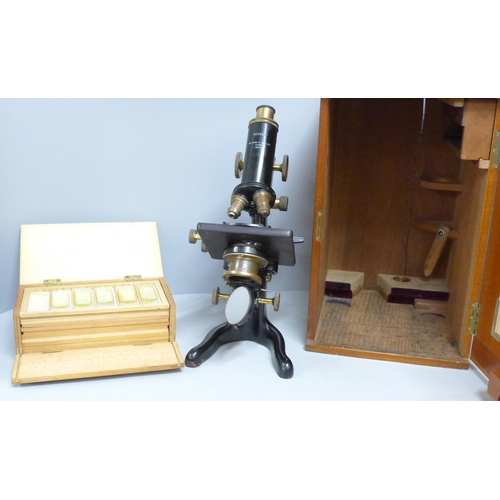 784 - A Watson microscope, cased and a case containing slides, microscope marked Service W. Watson & Sons ... 