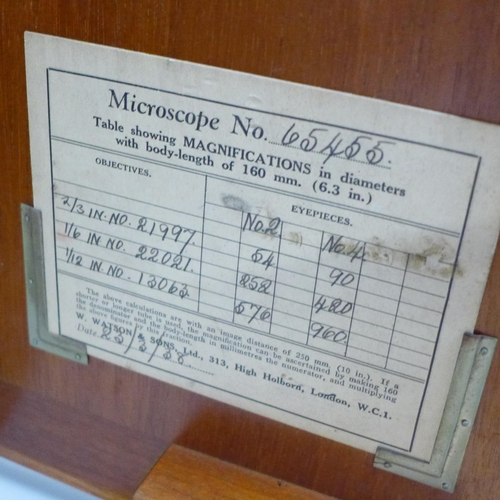 784 - A Watson microscope, cased and a case containing slides, microscope marked Service W. Watson & Sons ... 